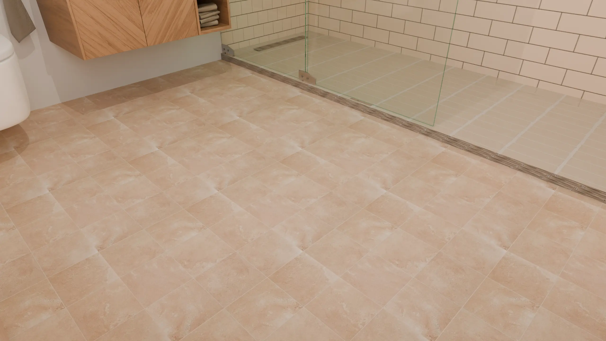 Close-up of square beige stone-look floor tiles with soft, cloudy patterns and light grout beside the shower.
