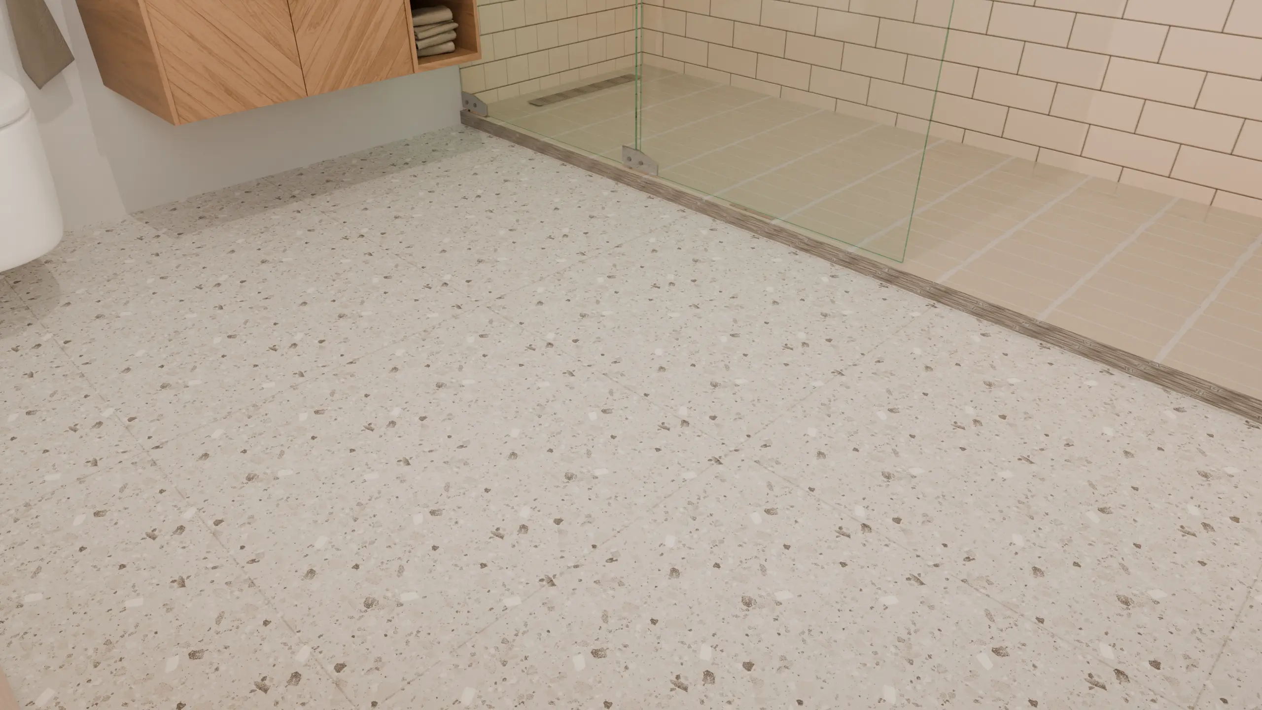 Close-up of cream terrazzo-look floor tiles with small beige, gray, and white chips and subtle grout lines.
